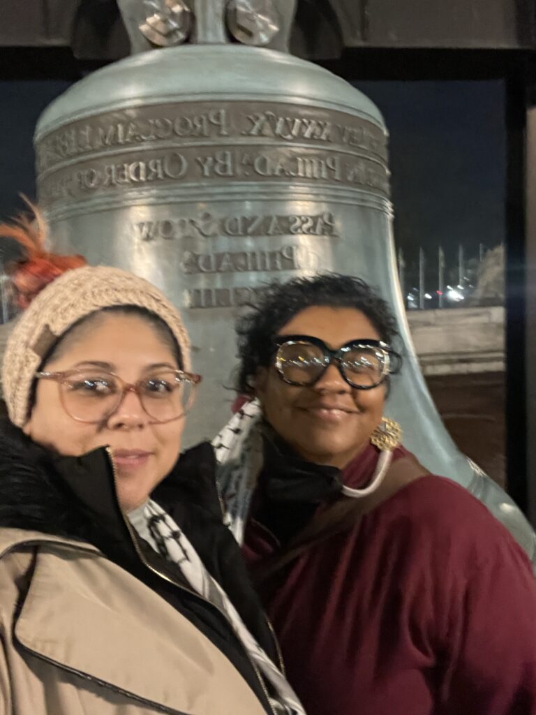 Images of Jesenia & Dee standing outside of Union Station, a large engraved bell behind them. 